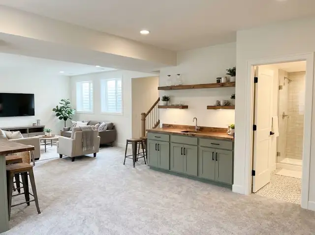 Illustration of a finished basement living area with a built-in bar