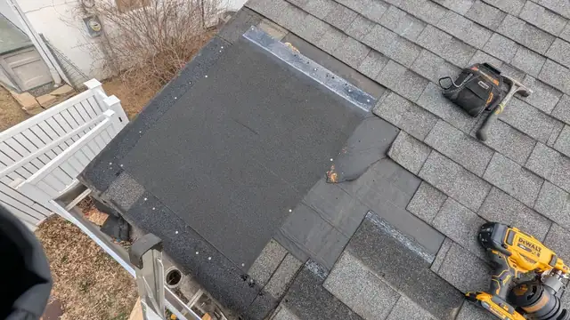 Roof repair in progress by Seth, with new underlayment laid where a storm-damaged section was removed